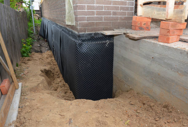 SJ Waterproofing Pros technician performing targeted Sump Pump Installation assessment in Kent, NY